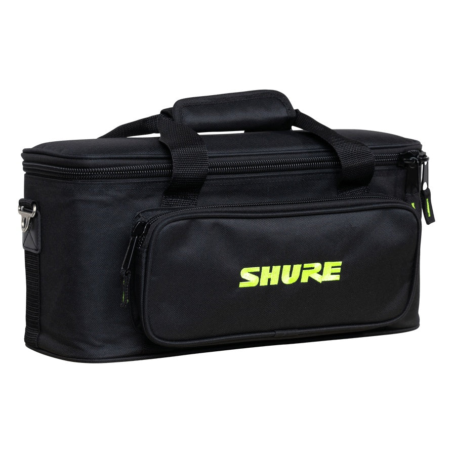 SH-MICBAG12 microphone bag angled front-left view showing zippered front pocket with green Shure logo, top carry handles and side D-ring strap mount, Gator