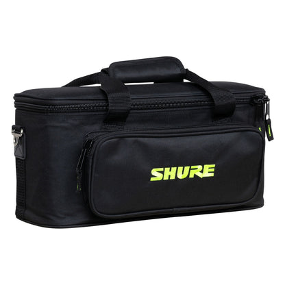 SH-MICBAG12 microphone bag angled front-left view showing zippered front pocket with green Shure logo, top carry handles and side D-ring strap mount, Gator