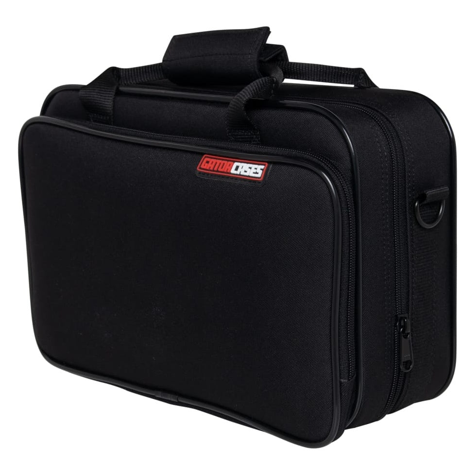 GBB-CLARINET beginner clarinet case angled front-left view showing red GatorCases badge, carry handle with grip wrap and side D-ring, Gator