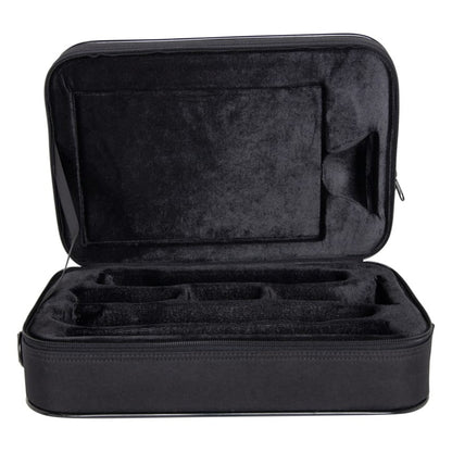 GBB-CLARINET beginner clarinet case open showing black plush-lined interior with molded compartments for clarinet sections and accessory pocket in lid, Gator
