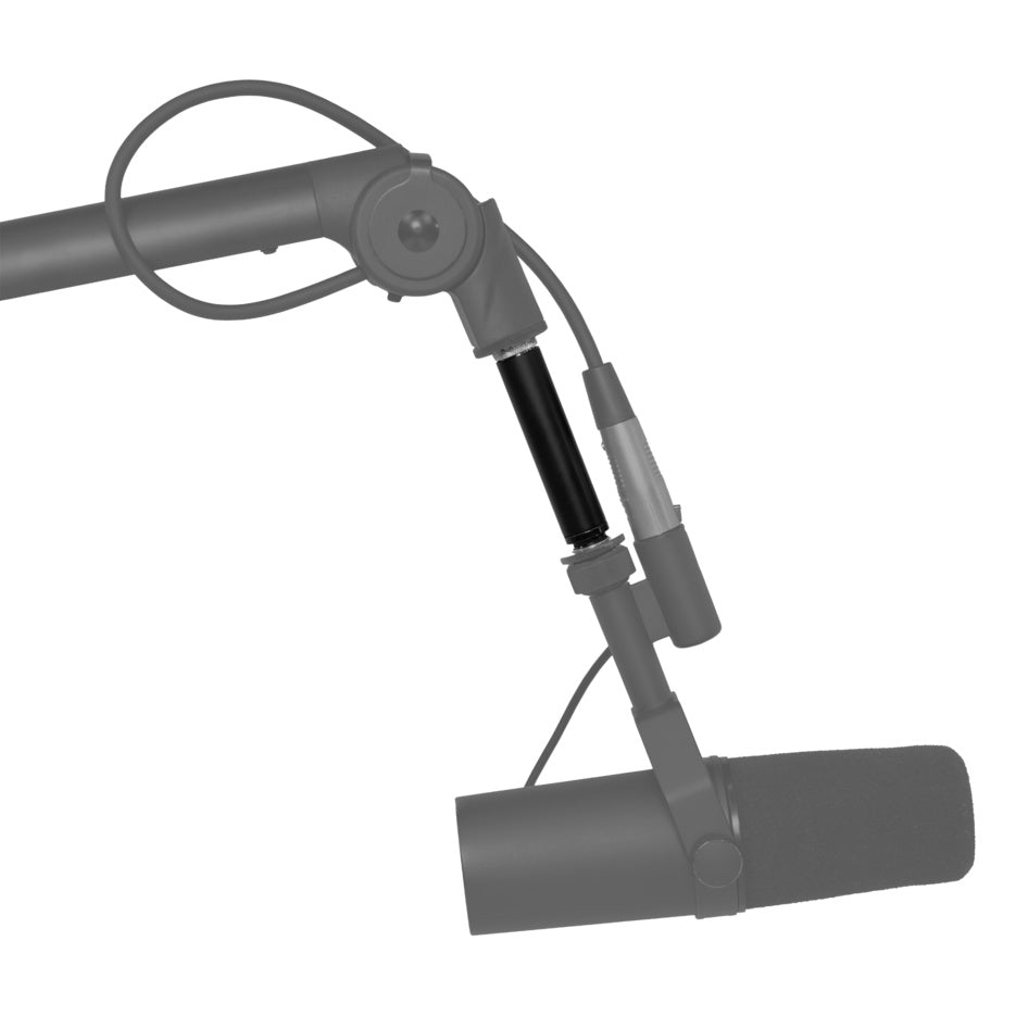 GFWMICBCBMEXT extension adapter installed between boom arm joint and microphone mount, highlighted in black against grayed-out mic and XLR cable, Gator