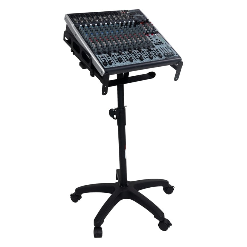 GFW-MIXERCART-0400 in use holding an angled analog mixing console on the tilted trays, raised on the height-adjustable column with rolling base, Gator