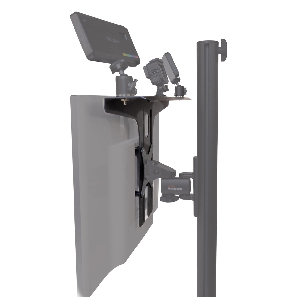 GFWMONITORSHELF side view of VESA-mounted accessory shelf on a monitor holding a video light and two small camera-style devices on ball heads, Gator