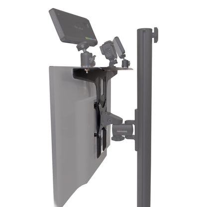 GFWMONITORSHELF side view of VESA-mounted accessory shelf on a monitor holding a video light and two small camera-style devices on ball heads, Gator