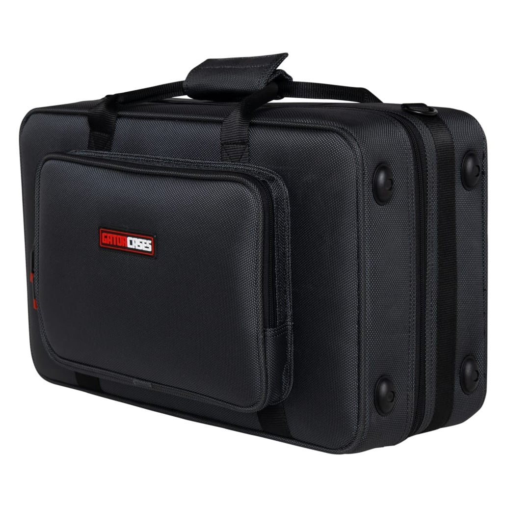GL-CORNET-23 cornet case angled three-quarter view showing rubber feet, top carry handle and front accessory pocket with Gator Cases logo patch, Gator