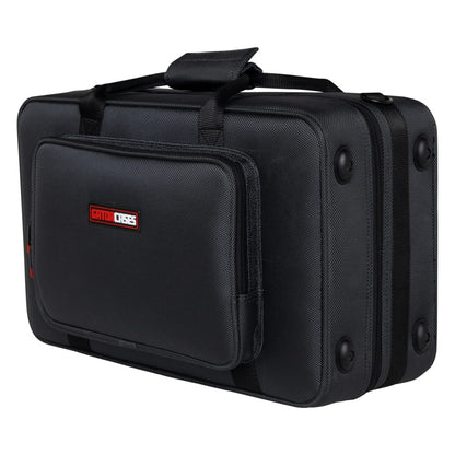 GL-CORNET-23 cornet case angled three-quarter view showing rubber feet, top carry handle and front accessory pocket with Gator Cases logo patch, Gator