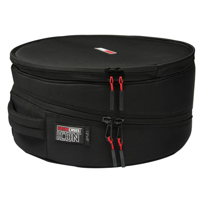 GP-ICON-1205SD 12x5 snare drum bag side view showing carry handle, ICON 12"x5" label and dual red-cord zipper pulls on the clamshell seam, Gator