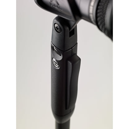 26200 Elegance One-Hand mic stand close-up of grip housing showing release lever, K&M badge, clip pivot screw and ribbed thumbwheel, K&M