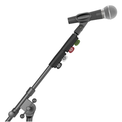 14510 pick holder in use clipped to a microphone stand boom tube below a mic clip and handheld microphone, with four coloured picks, K&M