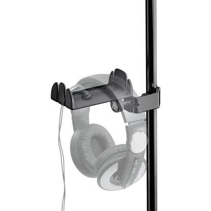 16080 headphone holder in use on a stand with over-ear headphones hanging from the cradle and the cable routed through the side slots, K&M
