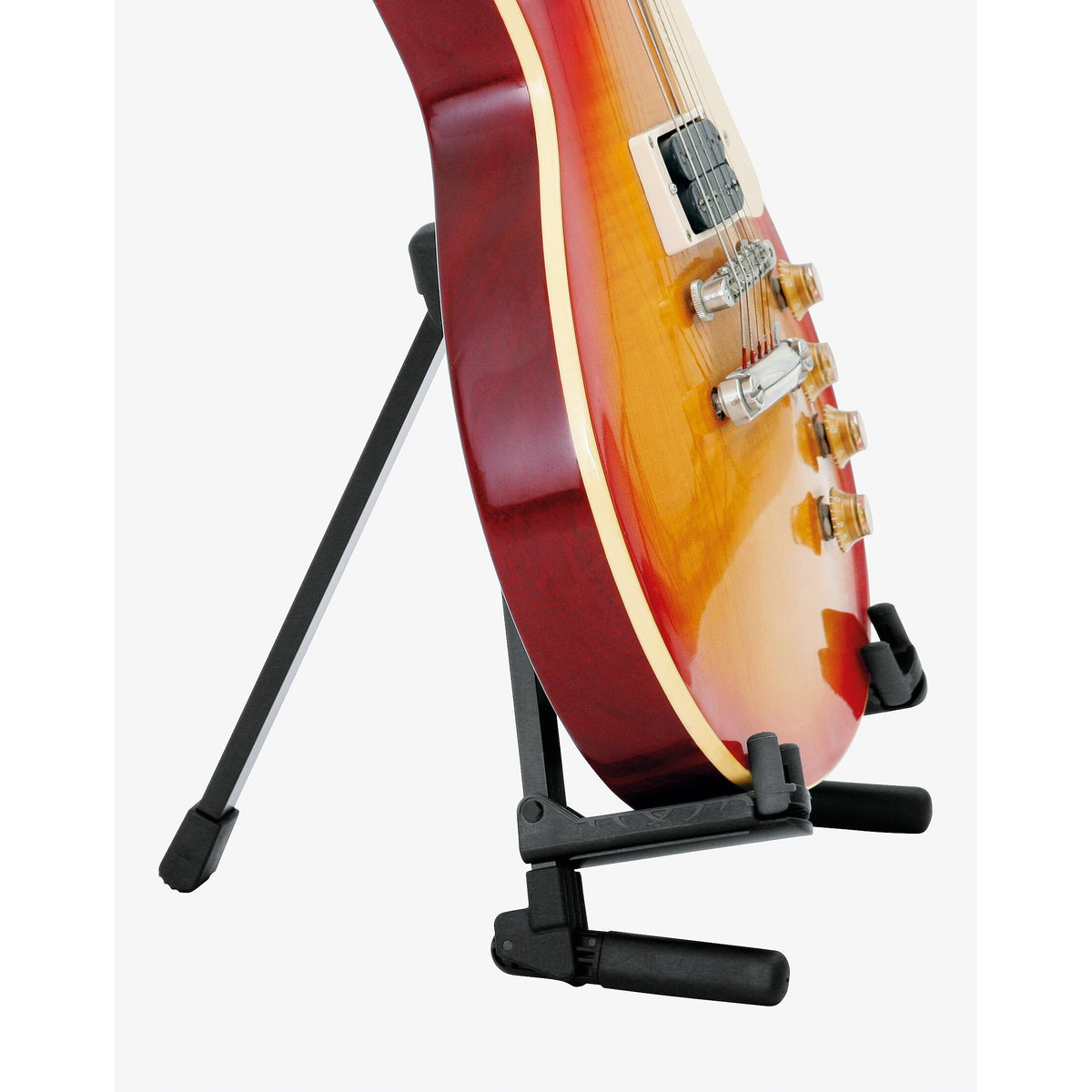 17550 Memphis Travel guitar stand in use supporting a cherry sunburst electric guitar by its lower body, with rear leg braced behind, K&M