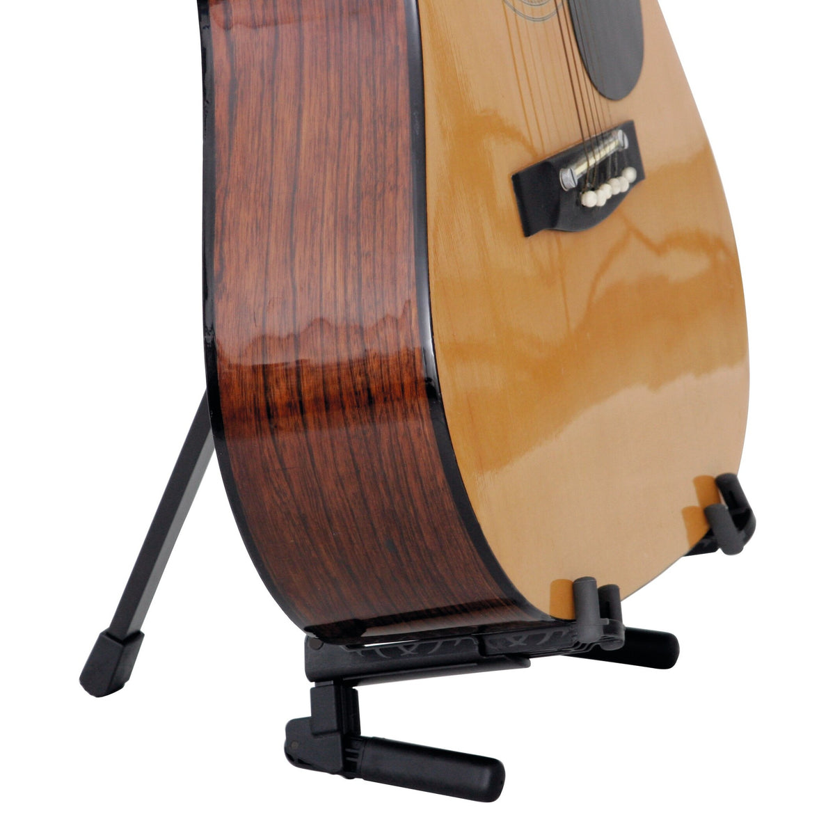 17550 Memphis Travel guitar stand in use holding a natural finish acoustic guitar upright on its rear leg and padded body cradle, K&M