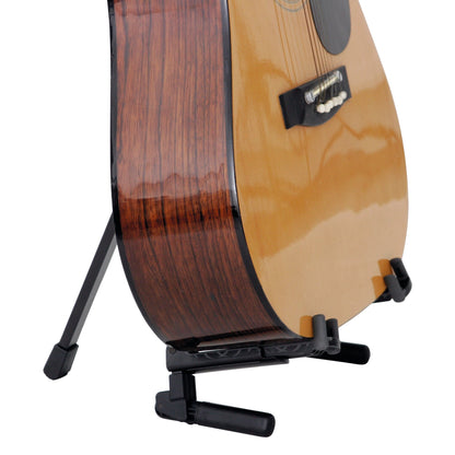 17550 Memphis Travel guitar stand in use holding a natural finish acoustic guitar upright on its rear leg and padded body cradle, K&M