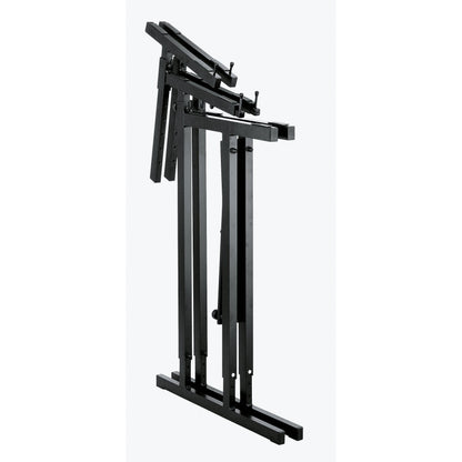 18880 table-style keyboard stand folded flat showing collapsed legs, adjustment holes and clamp knobs on the support arms, K&M
