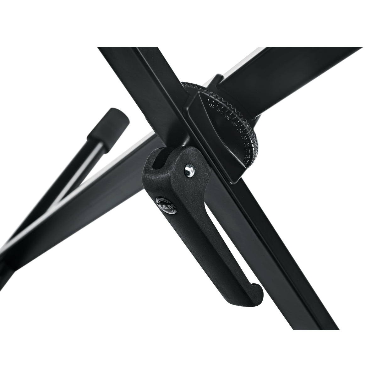18930 X-Stand keyboard stand center pivot detail showing serrated height adjustment wheel and black locking lever with K&M logo, K&M