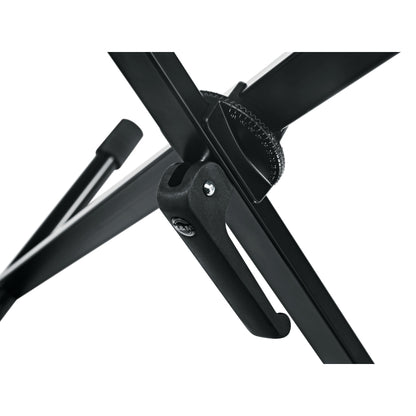 18930 X-Stand keyboard stand center pivot detail showing serrated height adjustment wheel and black locking lever with K&M logo, K&M