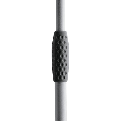 210/6 mic stand close-up of the black dimpled rubber clamp grip on the gray telescoping upright tube, K&M