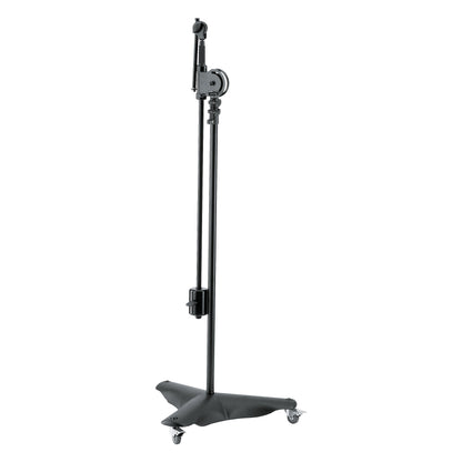 21430 overhead mic stand with boom arm folded down alongside the stand tube, counterweight clamped and casters on the cast base, K&M