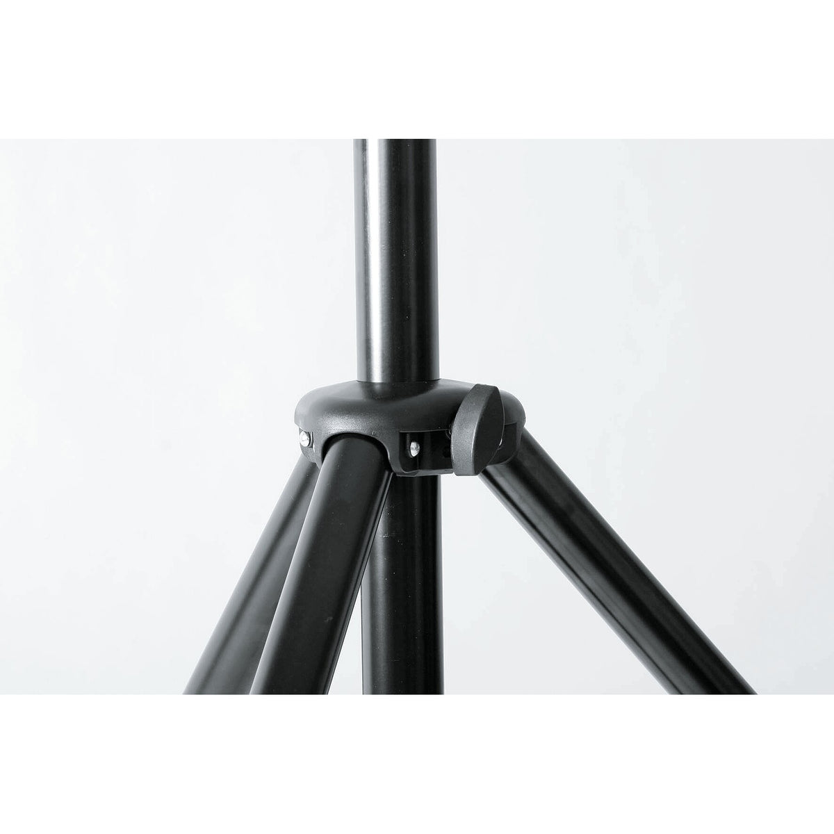 21435 speaker stand tripod head close-up showing black moulded hub with rivets and leg-lock knob where the legs join the pole, K&M