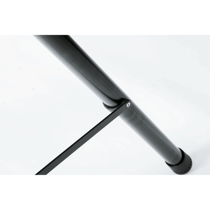 21435 speaker stand leg close-up showing riveted spreader brace bar fixed to the black steel leg above the rubber foot, K&M