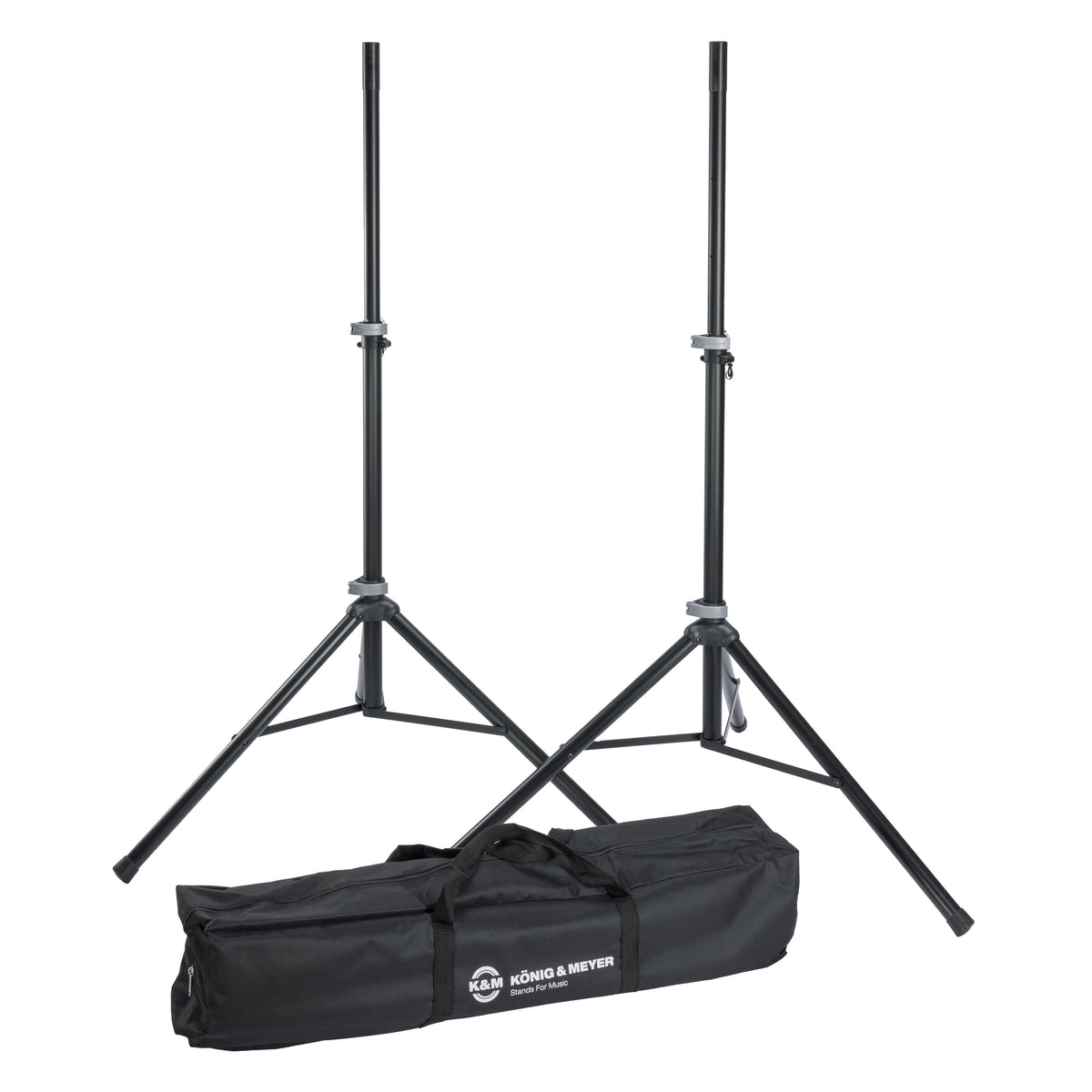 21459 speaker stand pair full set view with two black aluminum tripod stands extended beside the black carrying case printed with the K&M König & Meyer logo, K&M
