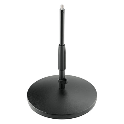 23320 low mic stand front view showing round textured cast iron base, telescoping black tube with ribbed clamp grip and 3/8 inch threaded top, K&M