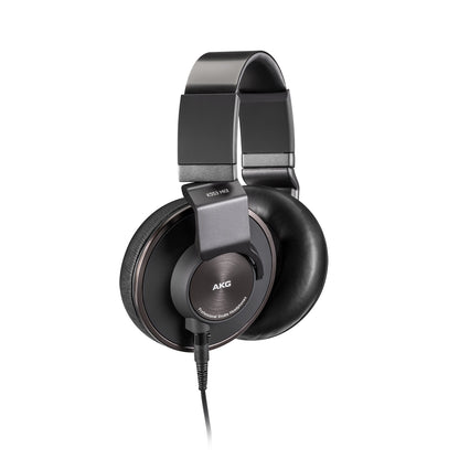 K553 MKII angled view of closed-back earcups showing swivel yokes and strain-relieved cable entry, AKG