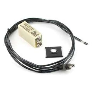 ISO9VOLTH isolated battery eliminator overview showing cream 9V-style housing, coiled black cable with barrel plug connector and small black square spacer plate, Lectrosonics