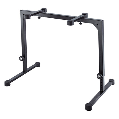 18810 Omega table-style keyboard stand front three-quarter view in black steel with adjustable legs and K&M clamping knobs, K&M