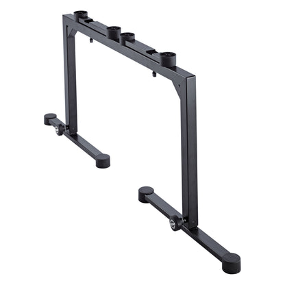 18810 Omega keyboard stand rear angled view showing top rail with four mounting sockets for add-on accessories and folded-in feet, K&M