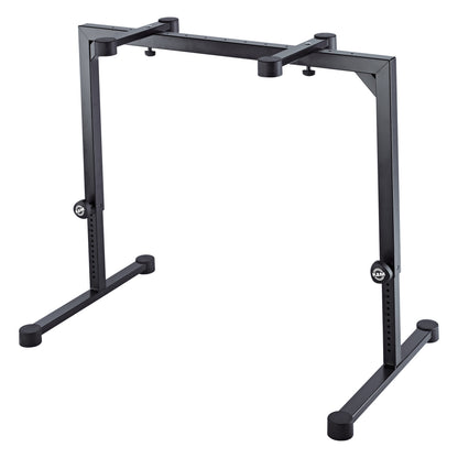 18810 Omega keyboard stand at raised height setting showing extended legs, perforated height-adjustment tubes and top support arms, K&M