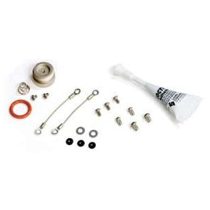 MMCABLE battery cap replacement kit parts layout showing metal cap, spring, orange O-ring, two lanyard cables, screws, washers, black seals and a tube of lubricant for MM Series transmitters, Lectrosonics