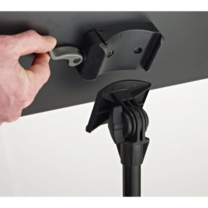 11870 orchestra music stand quick release desk detail with hand pulling the grey release lever to detach the desk from the tilt mount, K&M