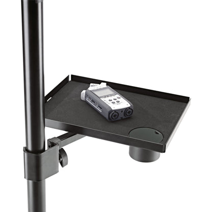12227 equipment tray in use clamped to a stand pole with a handheld audio recorder on the foam-lined shelf, K&M
