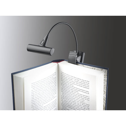 12247 LED FlexLight T-Model clipped to the cover of an open book, flexible gooseneck with switch on the lamp head, K&M