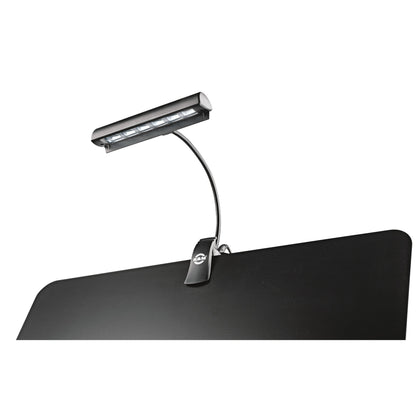 12248 Concert Orchestra music stand light clipped to the edge of a black music stand desk with LED strip switched on, K&M