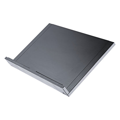 12338 conductor desk plate in retracted state seen from the front corner, showing brushed black surface and metal edge trim, K&M