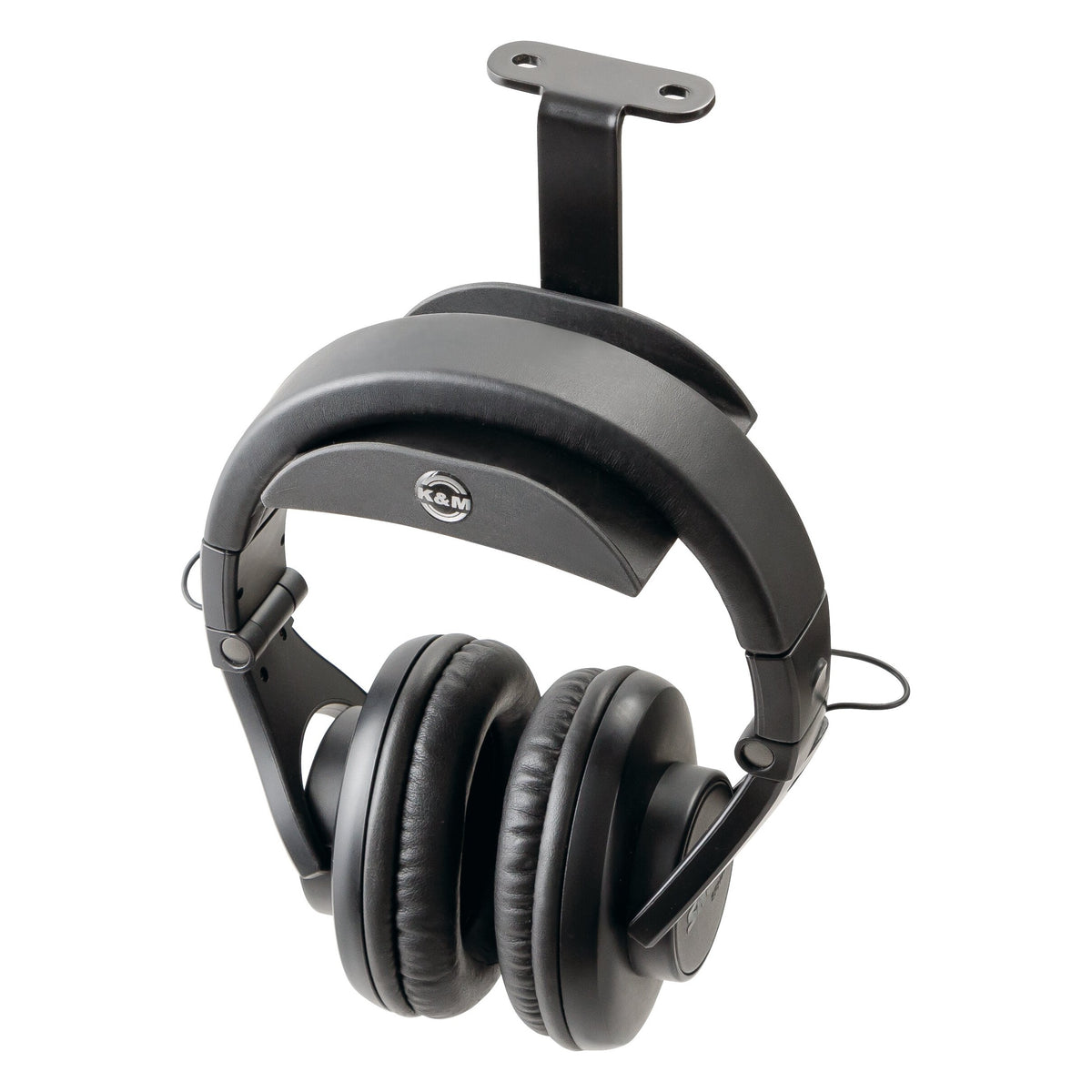16330 under-table headphone holder in use with over-ear studio headphones resting on the rubber support, mounting plate visible above, K&M