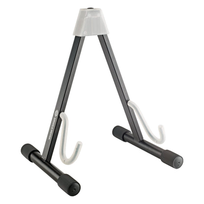 17540 folding electric guitar stand, front three-quarter view showing A-frame black legs, translucent neck rest and white rubber-coated support hooks, K&M
