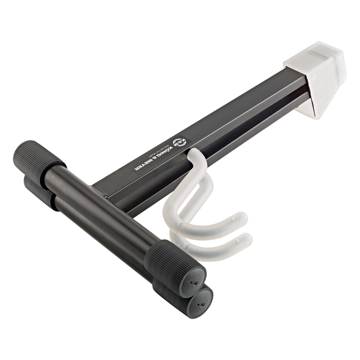 17540 folding electric guitar stand, folded flat showing knurled black foot tubes, K&M logo label on the leg and stacked translucent hooks, K&M