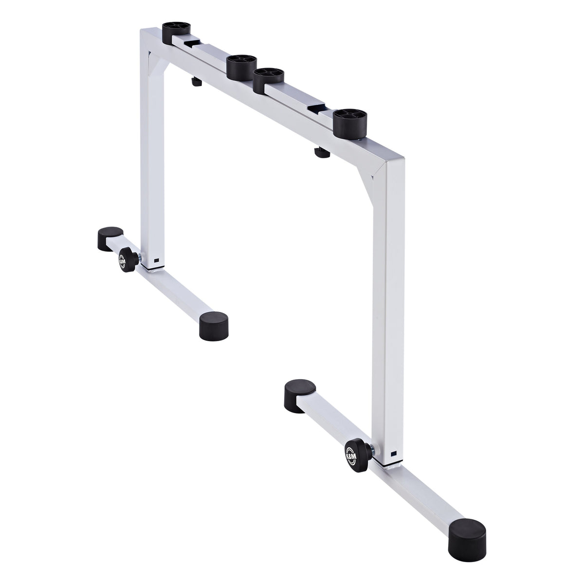 18810 Omega table stand angled rear view showing sliding top support arms with black rubber pads and folding base legs, K&M