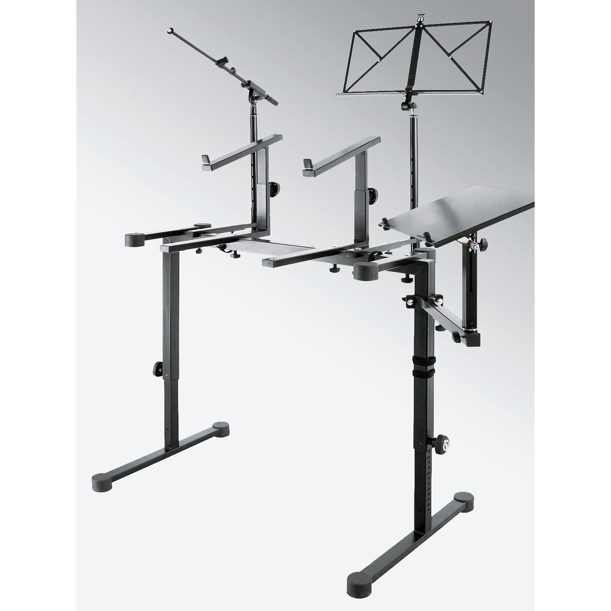 18815 laptop holder fitted to a keyboard table stand alongside a mic boom arm and music stand, K&M