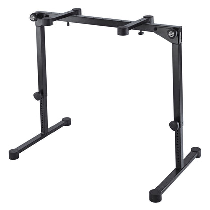 18820 Omega Pro table-style keyboard stand extended to a higher height setting showing leg adjustment holes and clamp knobs, K&M