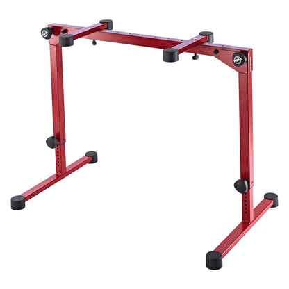 18820 Omega Pro table-style keyboard stand front three-quarter view in ruby red at mid height with black adjustment knobs and rubber feet, K&M