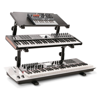 18828 Omega table stand basic support in a three-tier setup with 18811 stackers, a synth on a top shelf above two keyboards, K&M