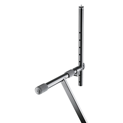18944 universal holder mounted on X-keyboard stand crossbar, angled view showing clamp and row of adjustment holes, K&M