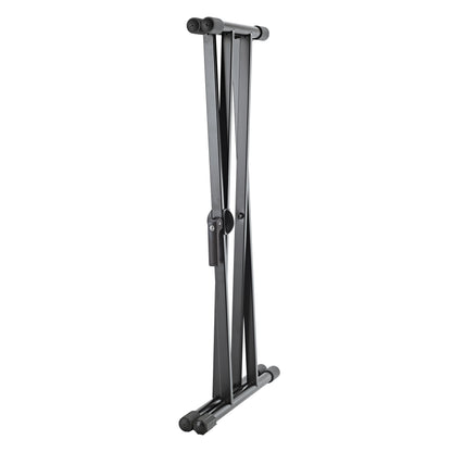18997 keyboard stand folded flat, side view with double-braced legs collapsed and the locking lever visible at the pivot, K&M