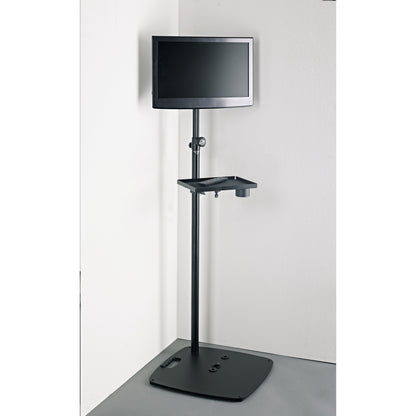 19610 stand adapter in use with monitor on a floor stand and an accessory tray holding a remote control and cup holder, K&M