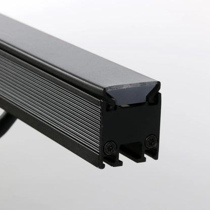 VDO Sceptron 320mm flat smoked diffuser end detail showing smoked lens seated in black finned extrusion with end-cap screws, Martin Lighting