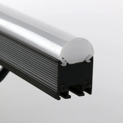 VDO Sceptron 1000mm round clear diffuser end detail seated on finned black extrusion with screw-secured end cap, Martin Lighting